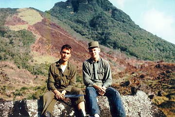 Jerry Long and Bruce Raisor sit on volcanic boulder with Pinatubo's