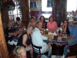 Same group (both photos taken by another customer who volunteered to hop up on his booth seat for that angle.)We're at Fudpucker's in Destin.