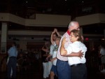 Donna dancing with a hot young thing (waiter) and Roger with our favorite waitress