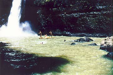 Raft carrying Valerie Long emerges from behind falls.